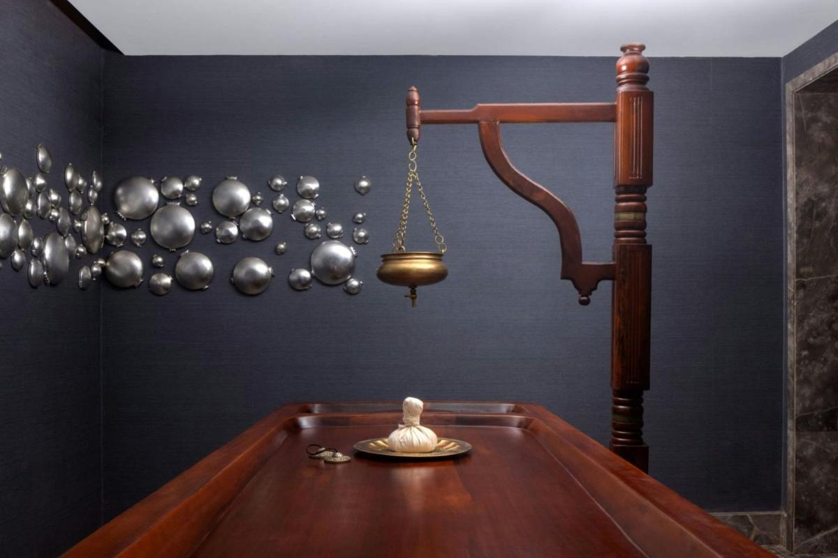 a room with a pool table with a scale at ITC Windsor, a Luxury Collection Hotel, Bengaluru in Bengaluru a room with a pool table with a scale at ITC Windsor, a Luxury Collection Hotel, Bengaluru in Bengaluru