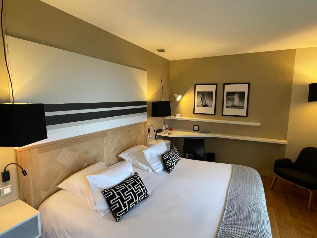 Un ou plusieurs lits dans un hébergement de l'établissement Hôtel - Spa Les Corderies