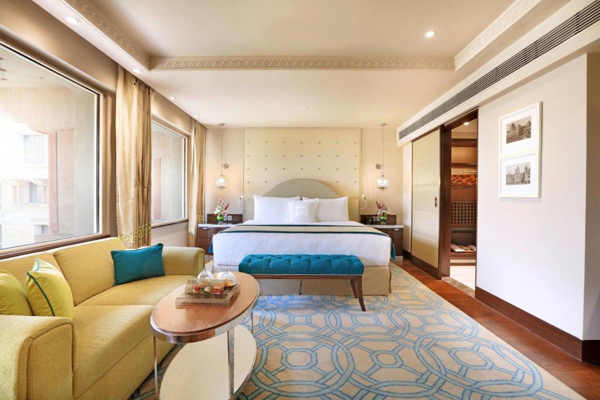 a hotel room with a bed and a couch at ITC Maratha, a Luxury Collection Hotel, Mumbai in Mumbai
