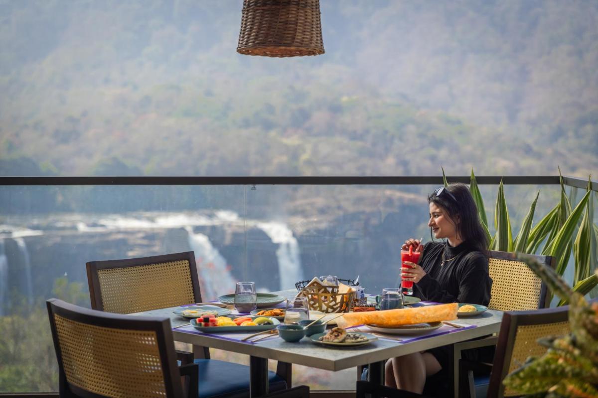 Flora Misty Falls Athirappilly - Housity