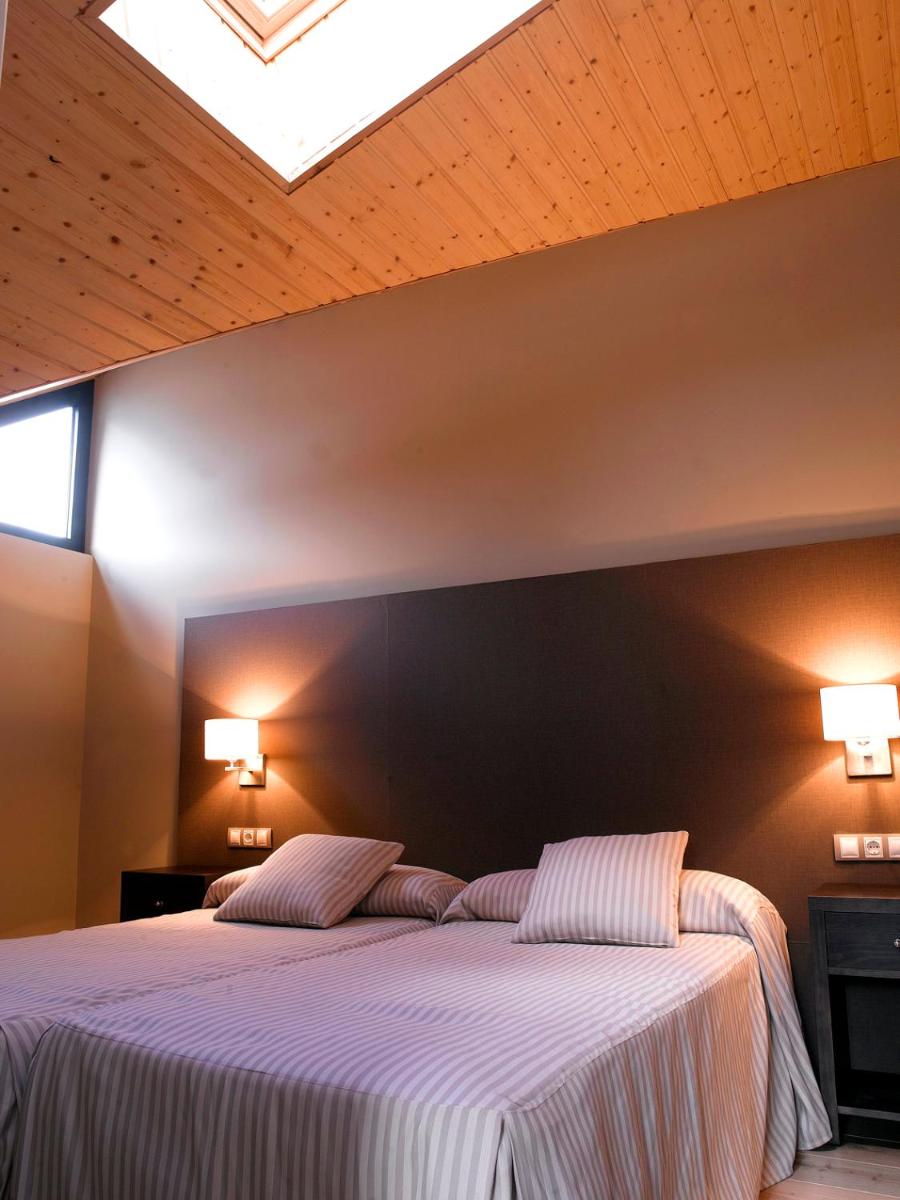 Cama o camas de una habitación en HG La Molina