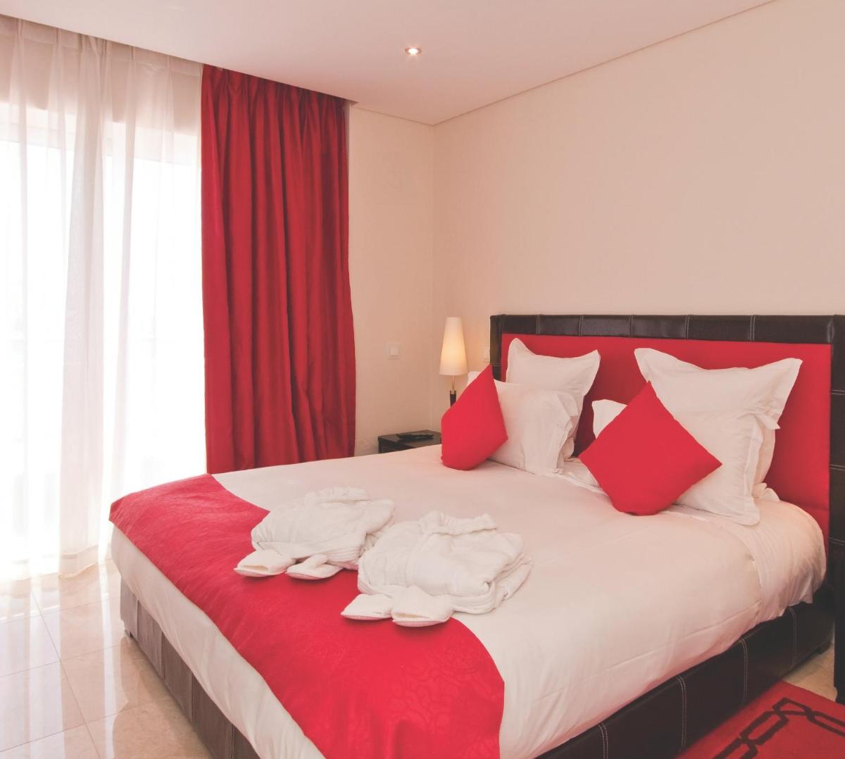 Uma cama ou camas num quarto em As Cascatas Golf Resort & Spa