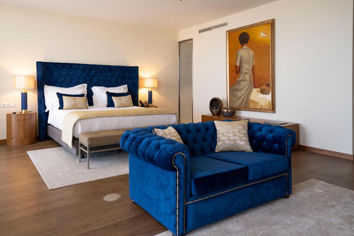 Uma cama ou camas num quarto em Boeira Garden Hotel Porto Gaia, Curio Collection by Hilton