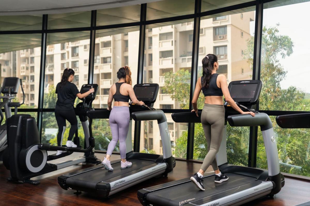 a group of women on treadmills in a gym at Marriott Suites Pune in Pune