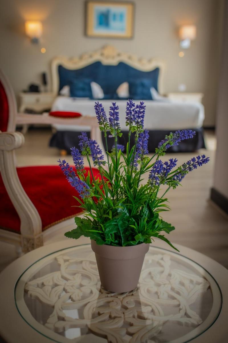 Un ou plusieurs lits dans un hébergement de l'établissement Alexain Hotel Restaurant & Wellness - Colmar Ouest