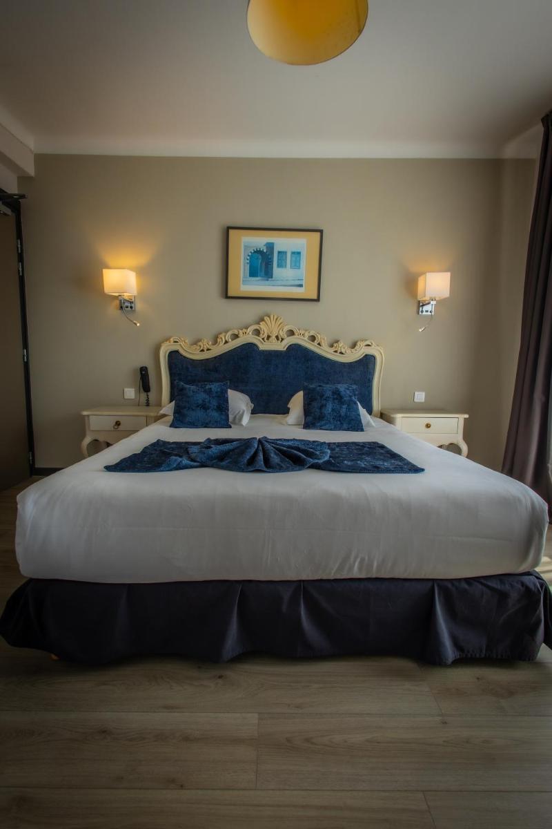 Un ou plusieurs lits dans un hébergement de l'établissement Alexain Hotel Restaurant & Wellness - Colmar Ouest