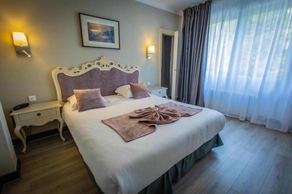 Un ou plusieurs lits dans un hébergement de l'établissement Alexain Hotel Restaurant & Wellness - Colmar Ouest