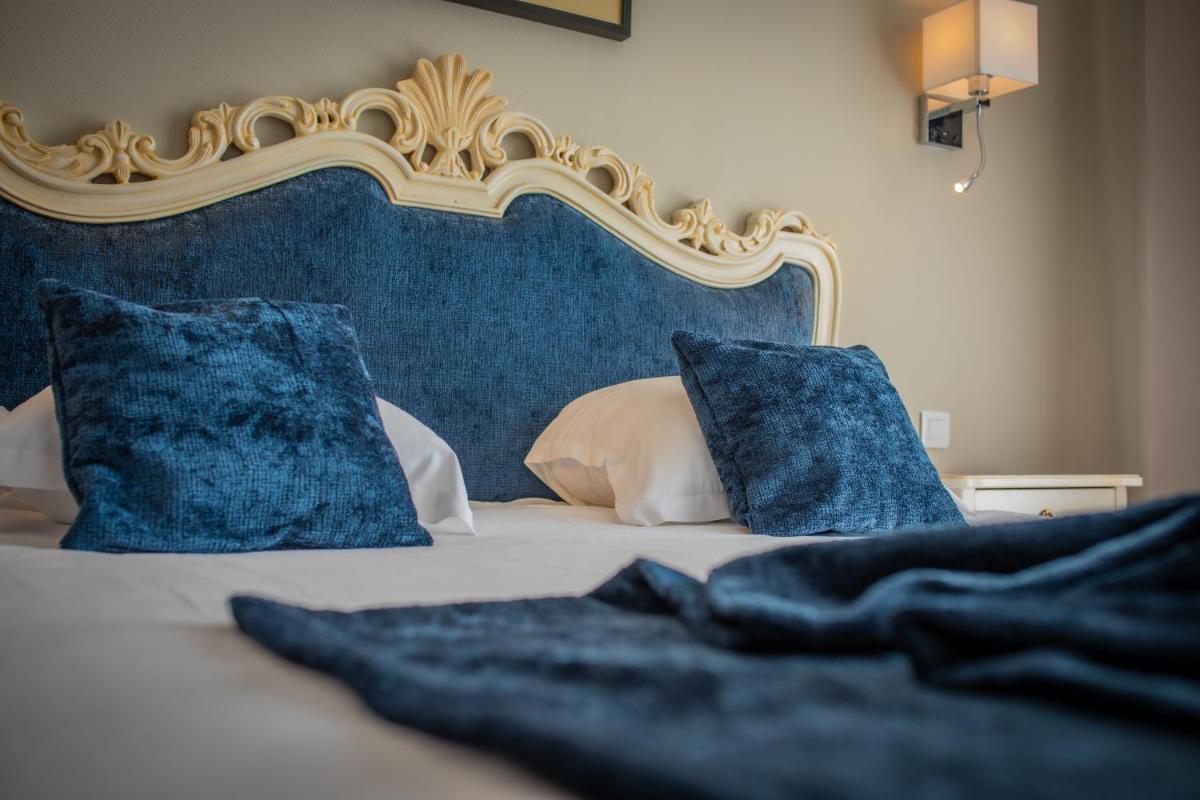 Un ou plusieurs lits dans un hébergement de l'établissement Alexain Hotel Restaurant & Wellness - Colmar Ouest