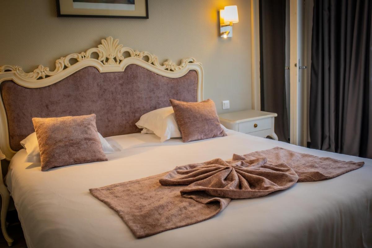 Un ou plusieurs lits dans un hébergement de l'établissement Alexain Hotel Restaurant & Wellness - Colmar Ouest