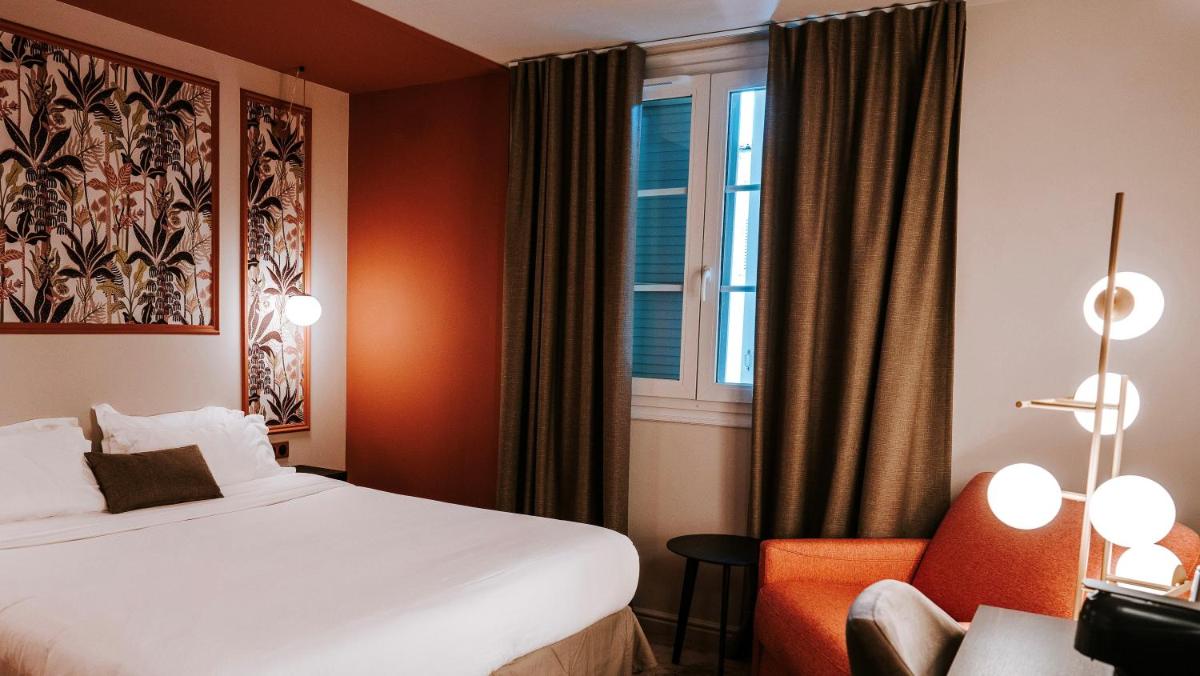 Un ou plusieurs lits dans un hébergement de l'établissement Hôtel Fesch & Spa