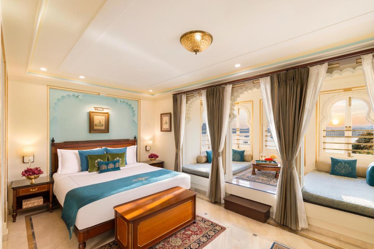 a bedroom with a bed and a window at Taj Fateh Prakash Palace Udaipur in Udaipur