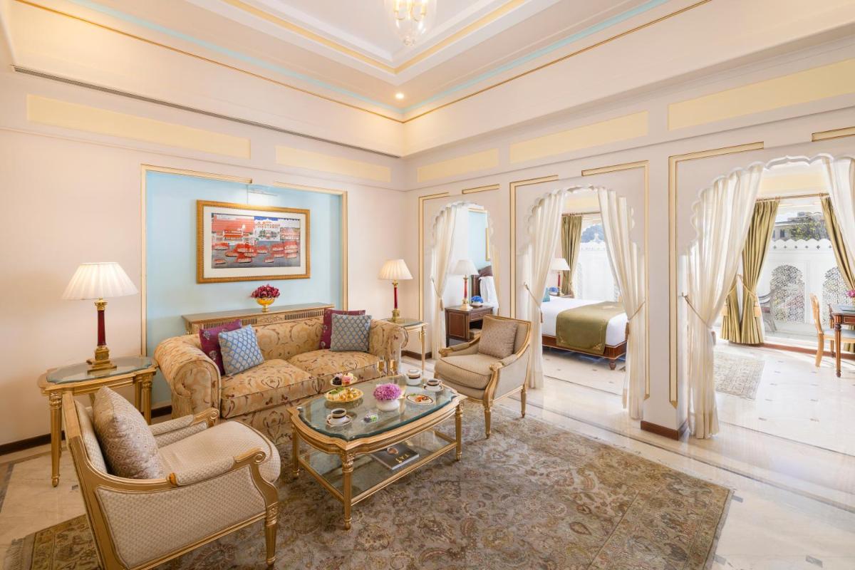 a living room with a couch and a table at Taj Fateh Prakash Palace Udaipur in Udaipur