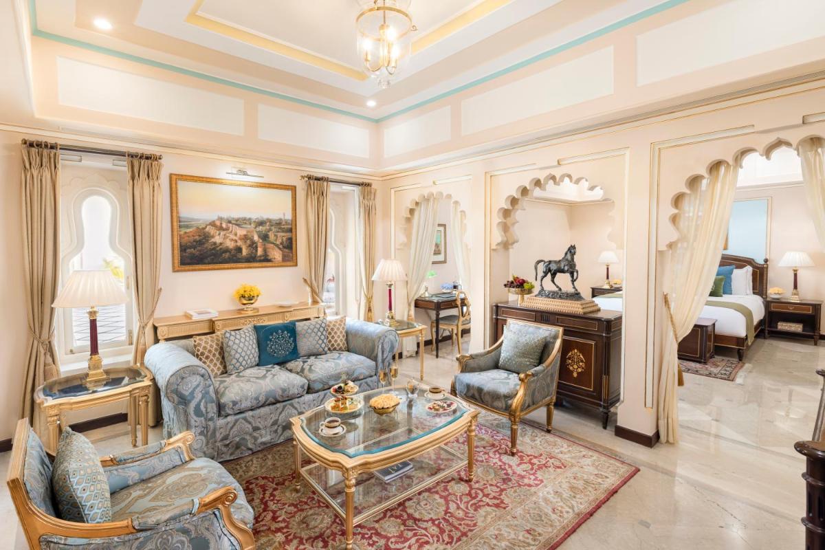 a living room with a couch and a table at Taj Fateh Prakash Palace Udaipur in Udaipur