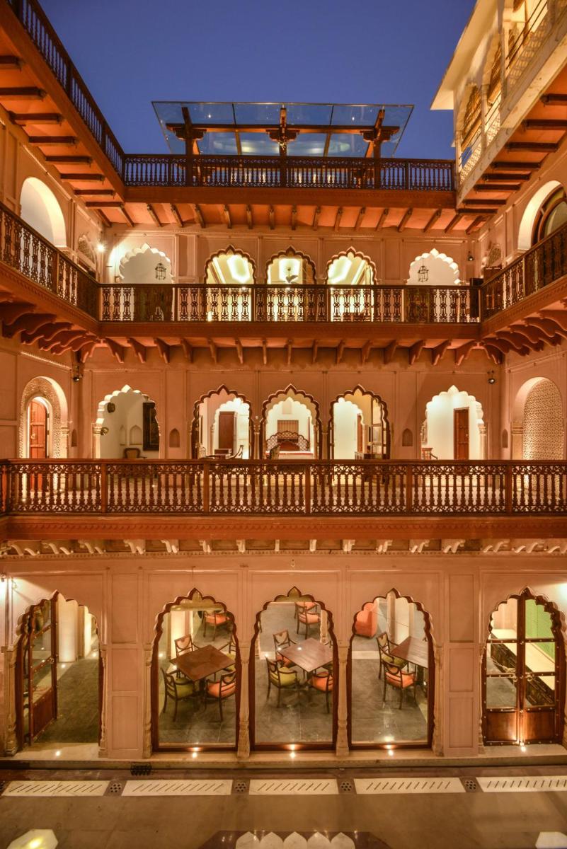 an image of a building with a balcony at Haveli Dharampura & Golden Haveli- UNESCO awarded Boutique Heritage Hotel in New Delhi an image of a building with a balcony at Haveli Dharampura & Golden Haveli- UNESCO awarded Boutique Heritage Hotel in New Delhi