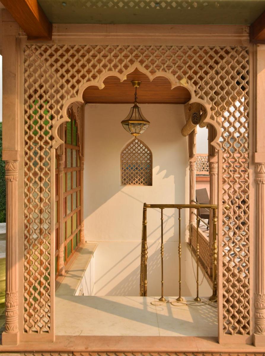 an entrance to a house with a staircase in a building at Haveli Dharampura & Golden Haveli- UNESCO awarded Boutique Heritage Hotel in New Delhi an entrance to a house with a staircase in a building at Haveli Dharampura & Golden Haveli- UNESCO awarded Boutique Heritage Hotel in New Delhi