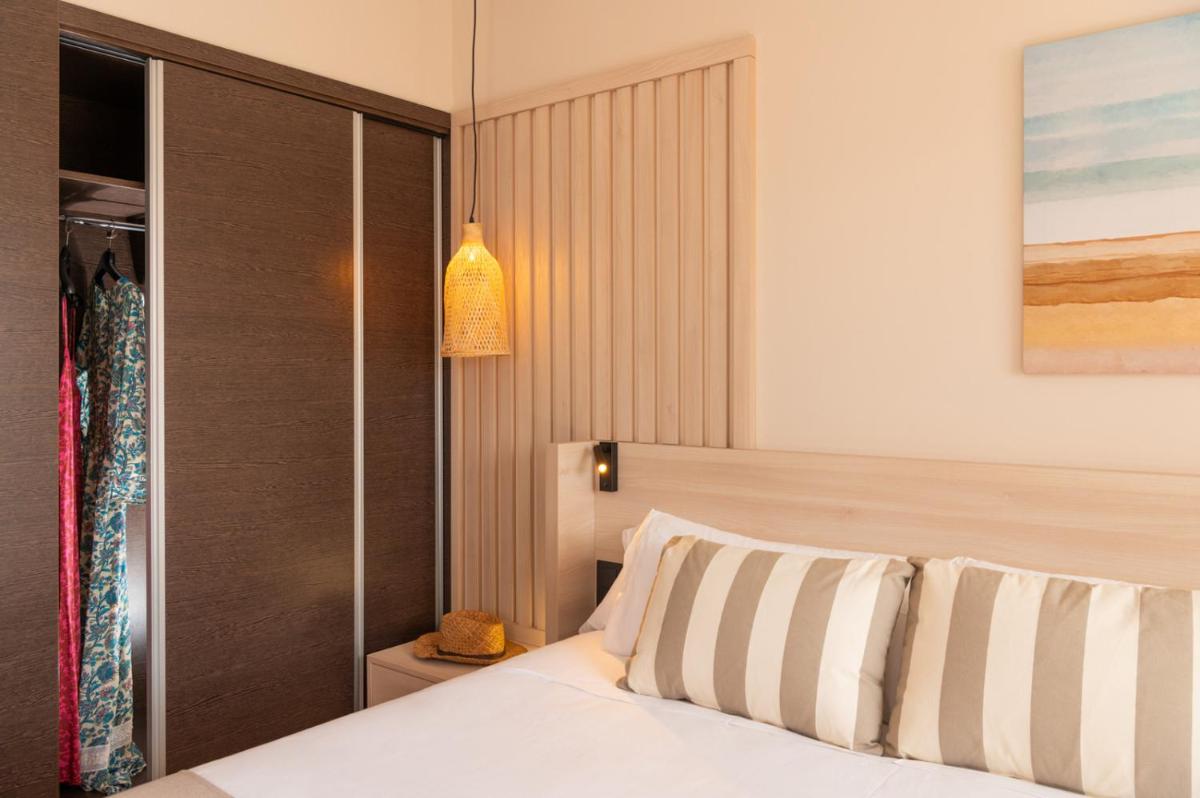 Cama o camas de una habitación en AQUA Hotel The Breeze & Spa - All Inclusive - Adults Only - 4Sup