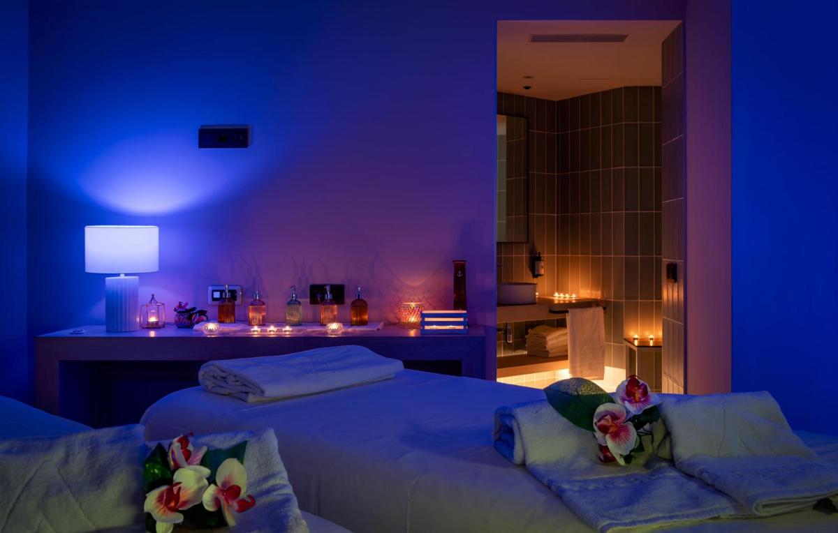 Cama o camas de una habitación en AQUA Hotel The Breeze & Spa - All Inclusive - Adults Only - 4Sup