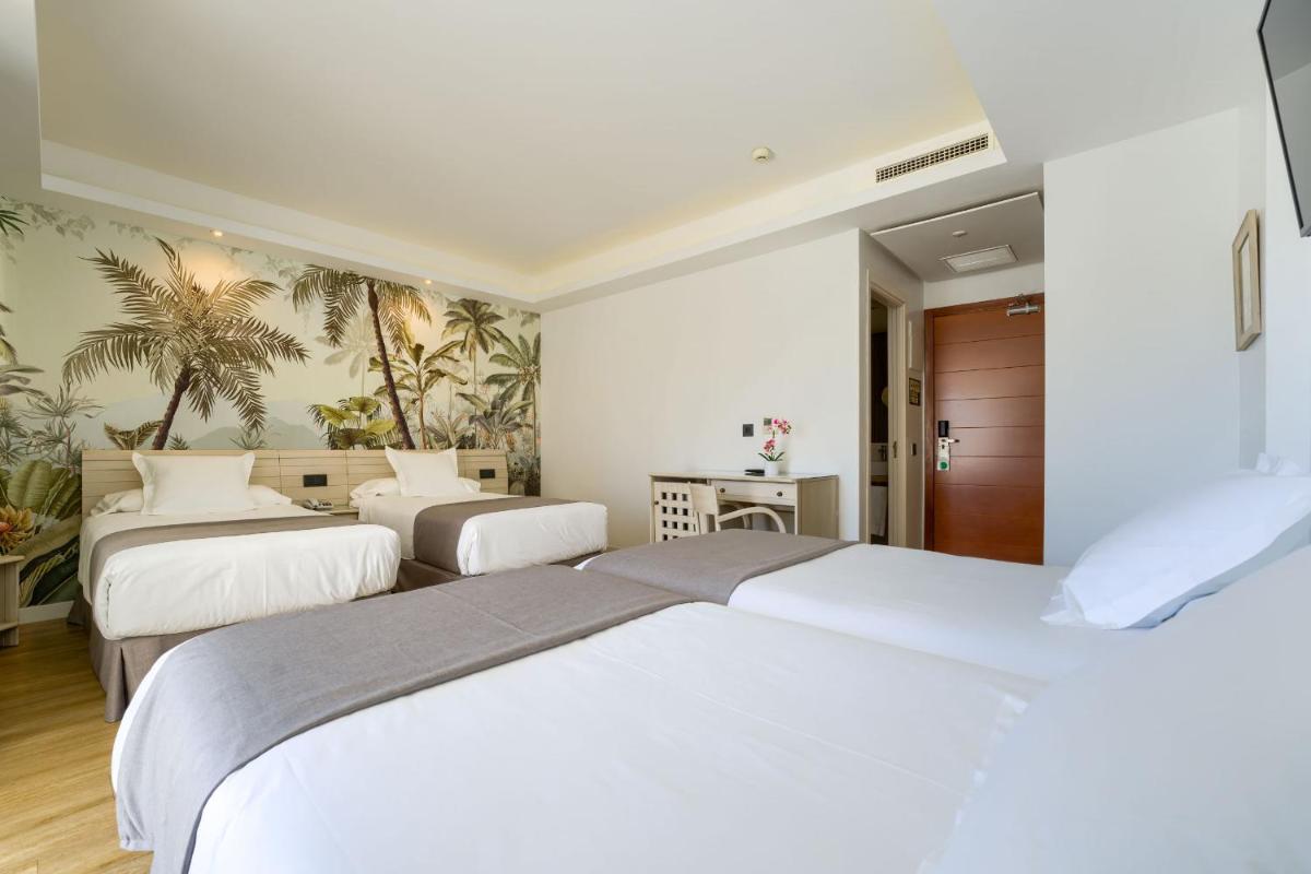 Cama o camas de una habitación en Hotel Puerto Bahía & Spa