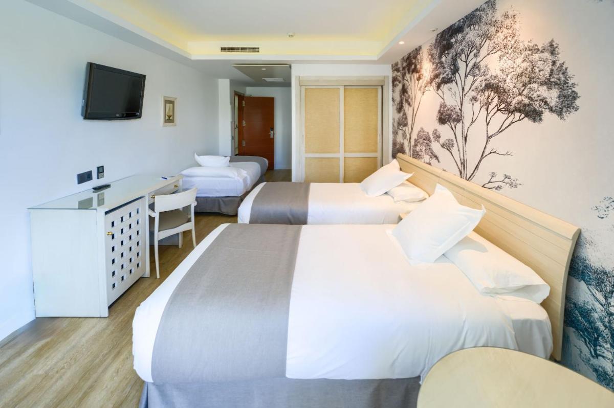 Cama o camas de una habitación en Hotel Puerto Bahía & Spa