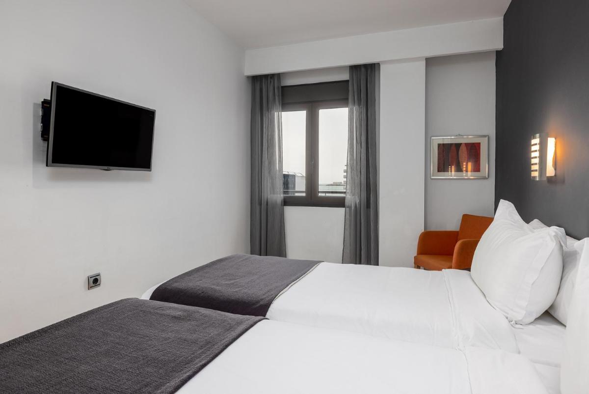 Cama o camas de una habitación en Hotel Spa Cádiz Plaza