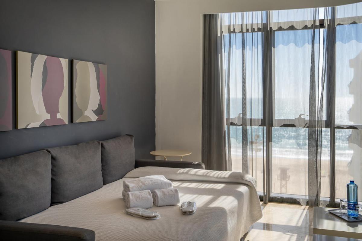 Cama o camas de una habitación en Hotel Spa Cádiz Plaza