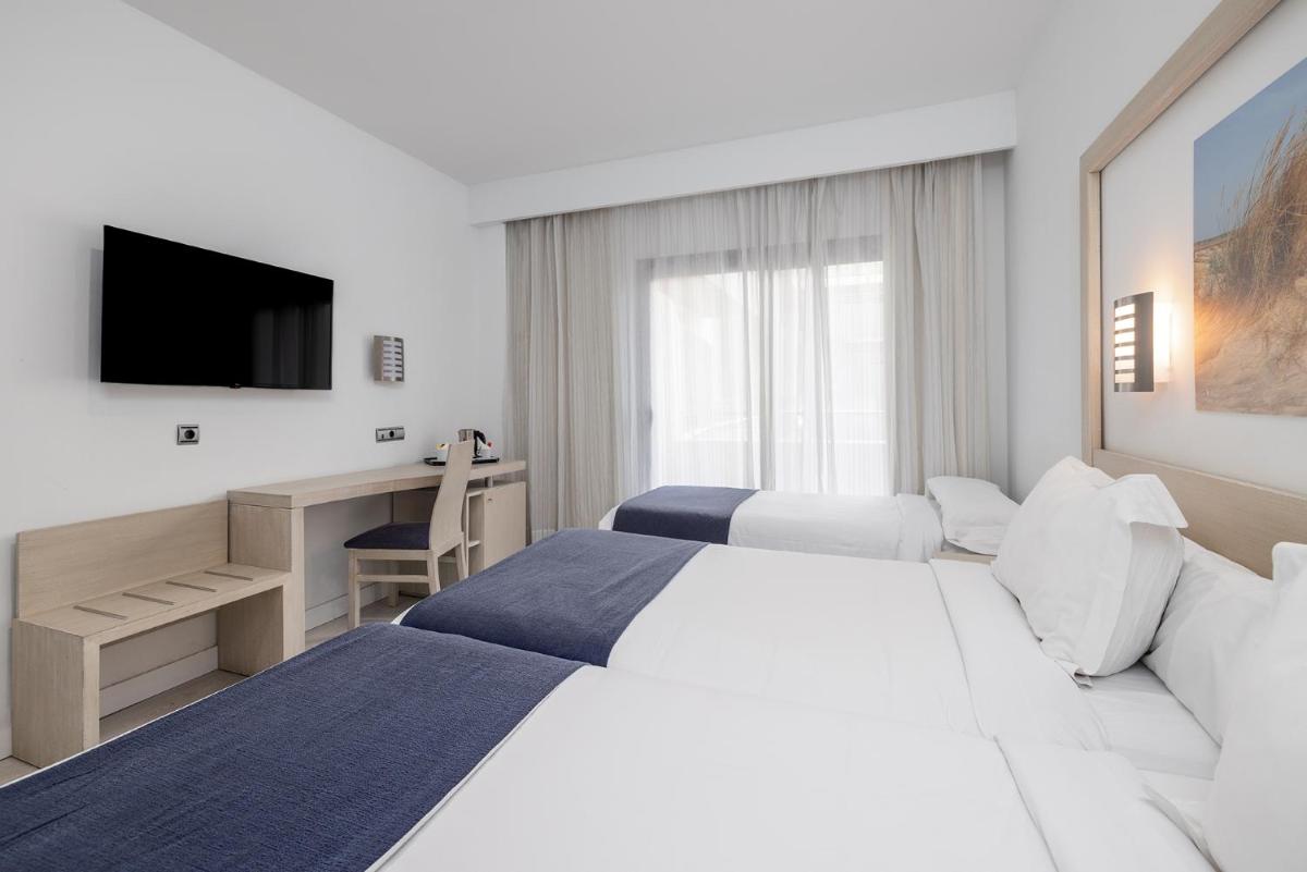 Cama o camas de una habitación en Hotel Spa Cádiz Plaza