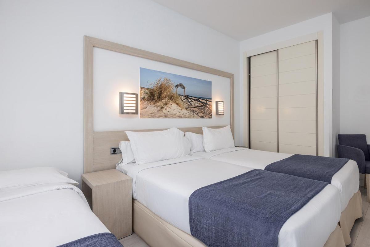 Cama o camas de una habitación en Hotel Spa Cádiz Plaza