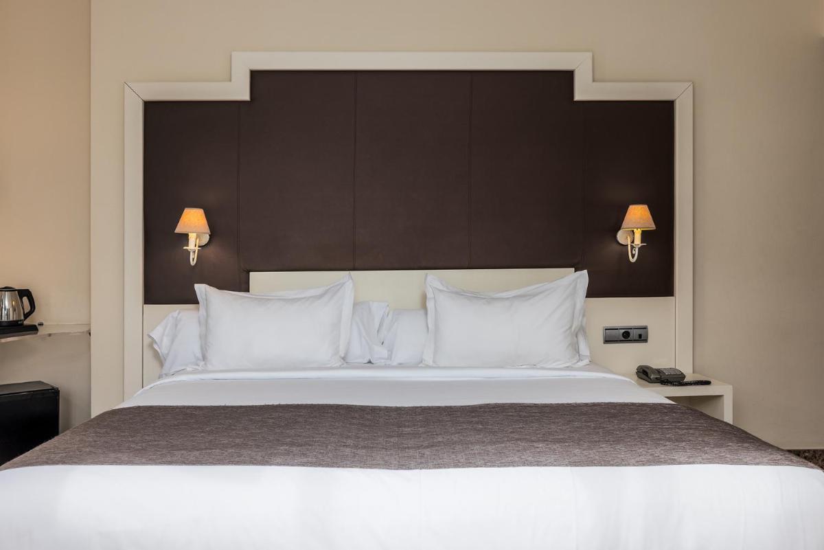Cama o camas de una habitación en Hotel Spa Cádiz Plaza