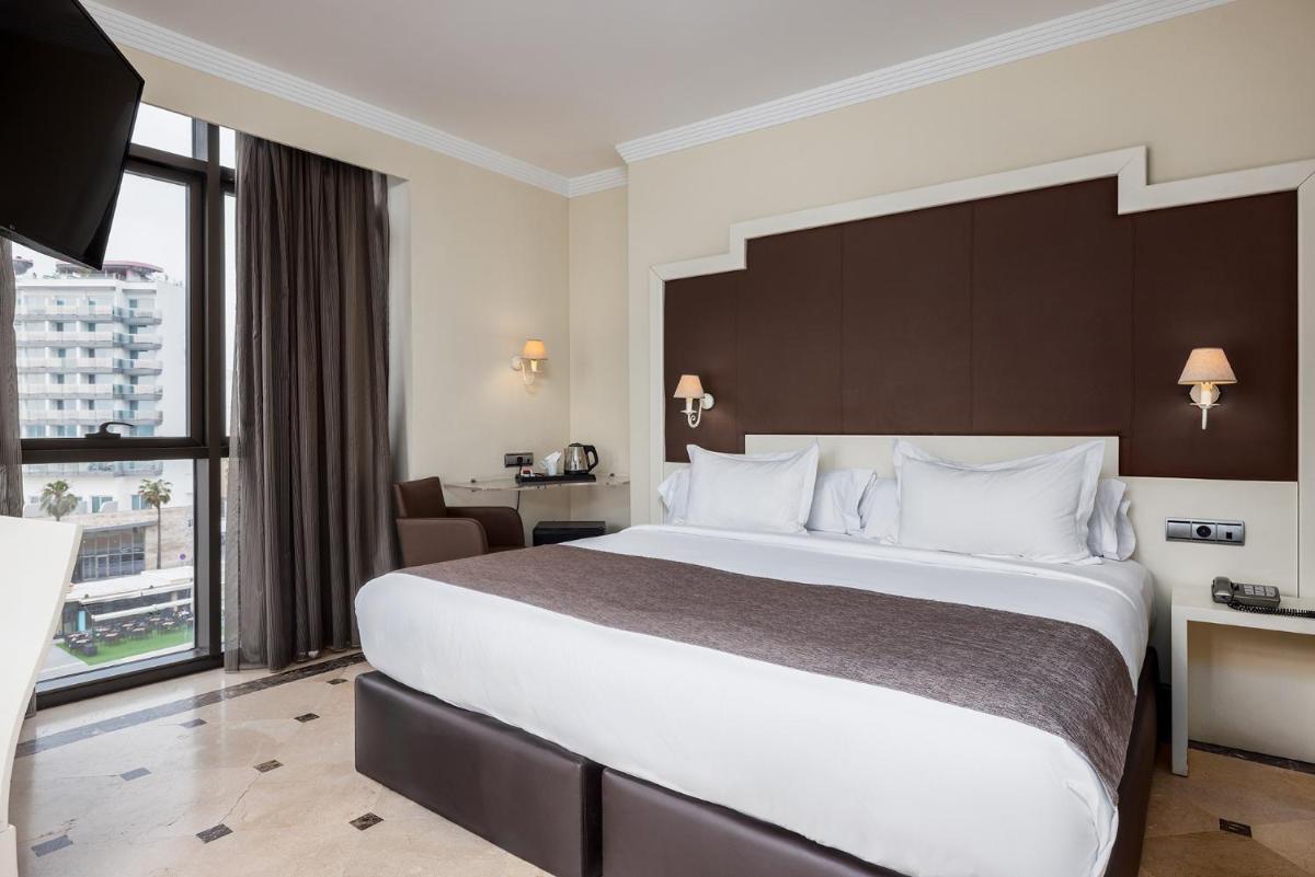 Cama o camas de una habitación en Hotel Spa Cádiz Plaza