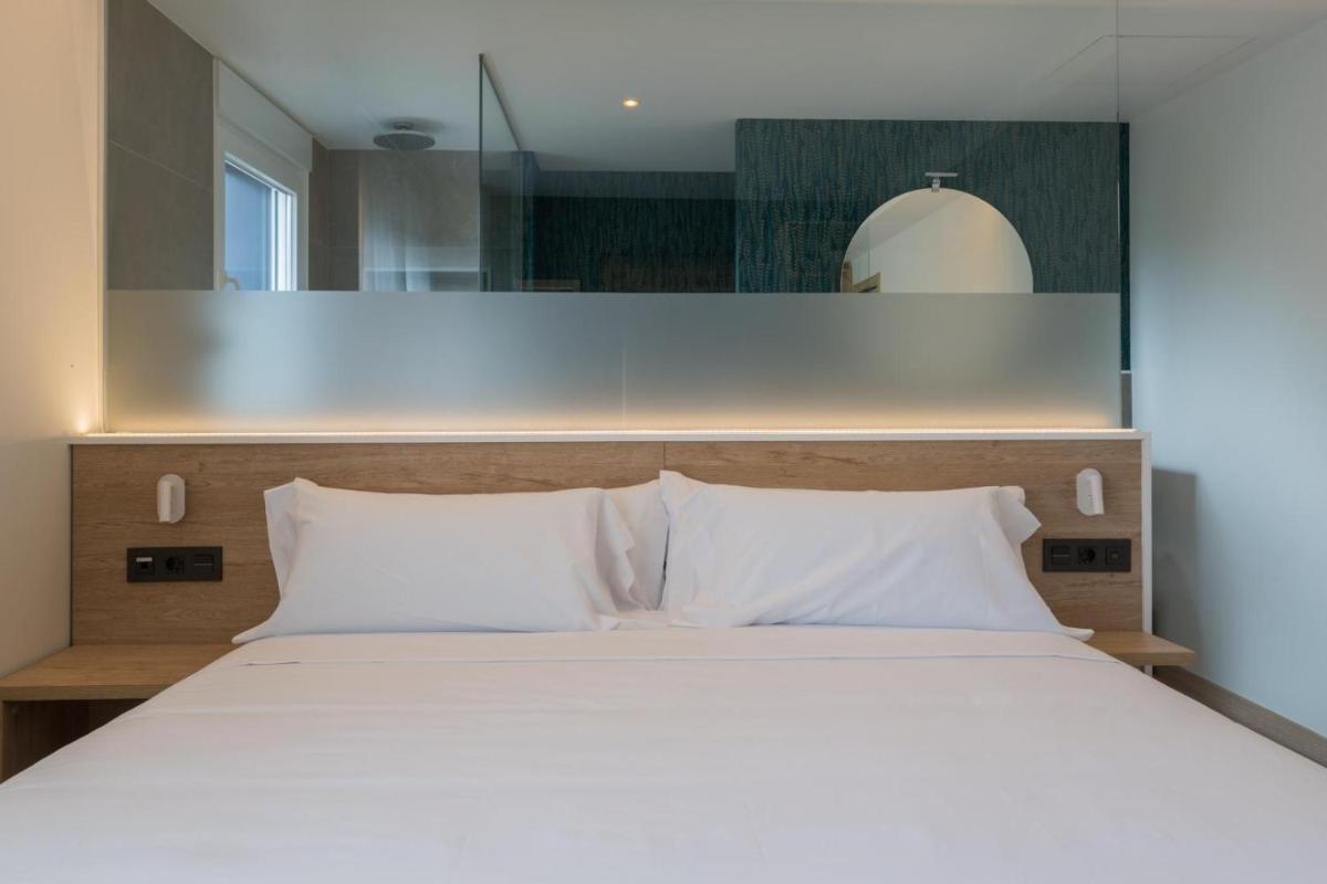 Cama o camas de una habitación en Hotel Spa Meiga do Mar