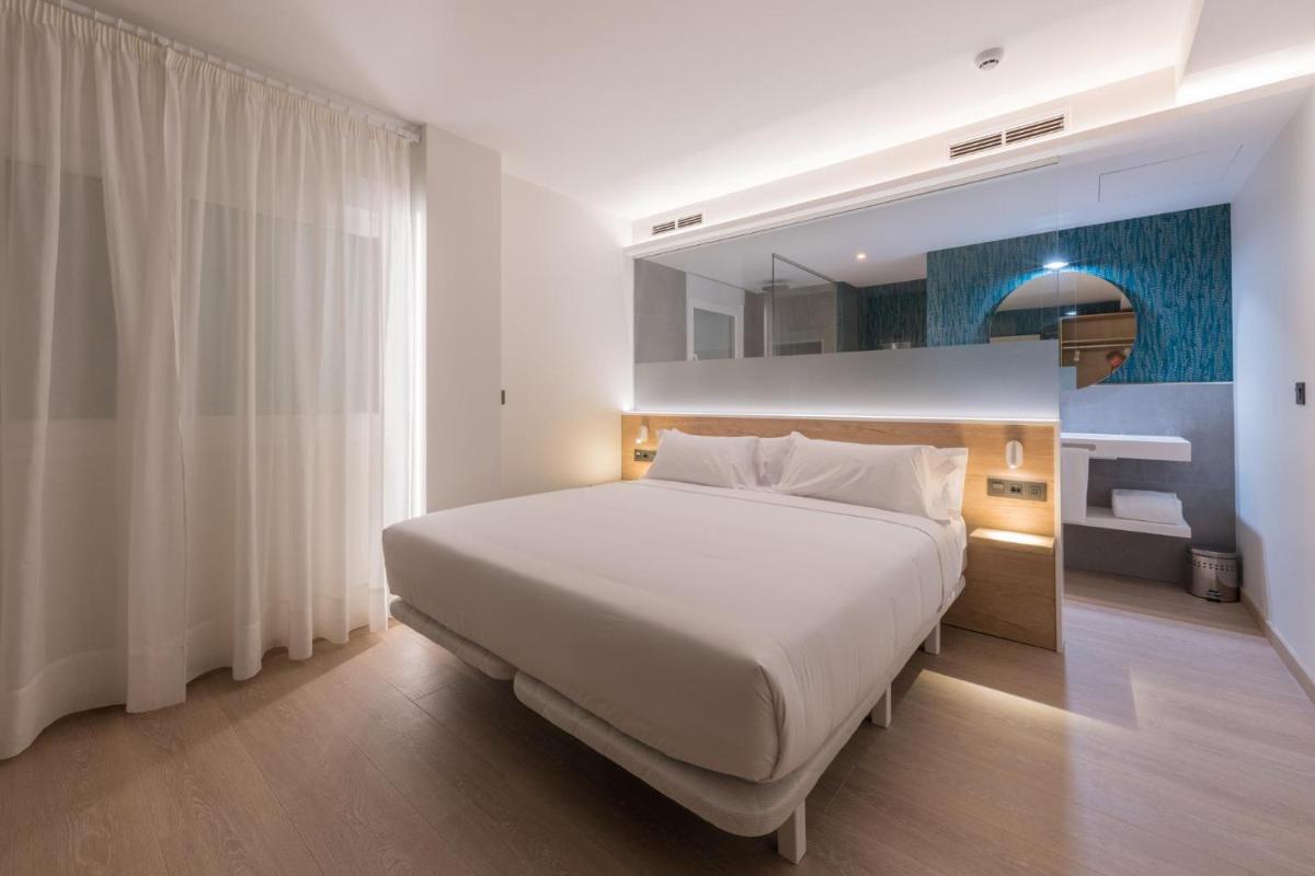 Cama o camas de una habitación en Hotel Spa Meiga do Mar