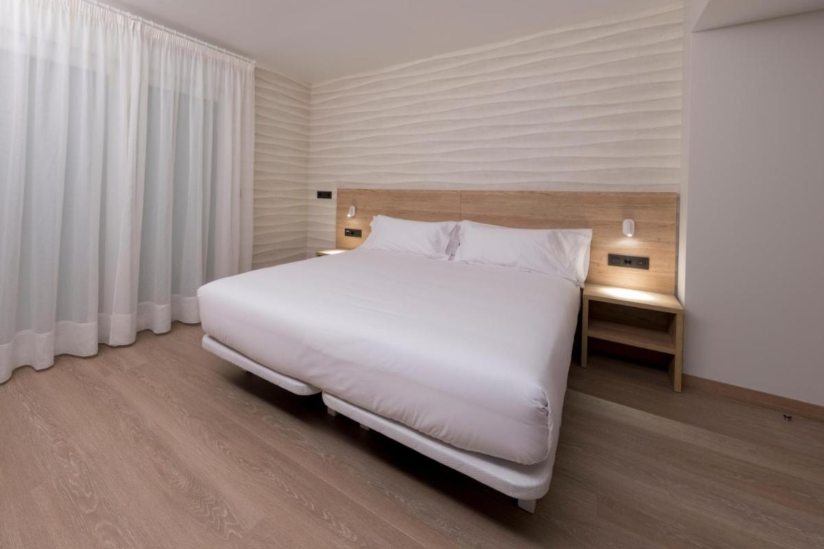 Cama o camas de una habitación en Hotel Spa Meiga do Mar