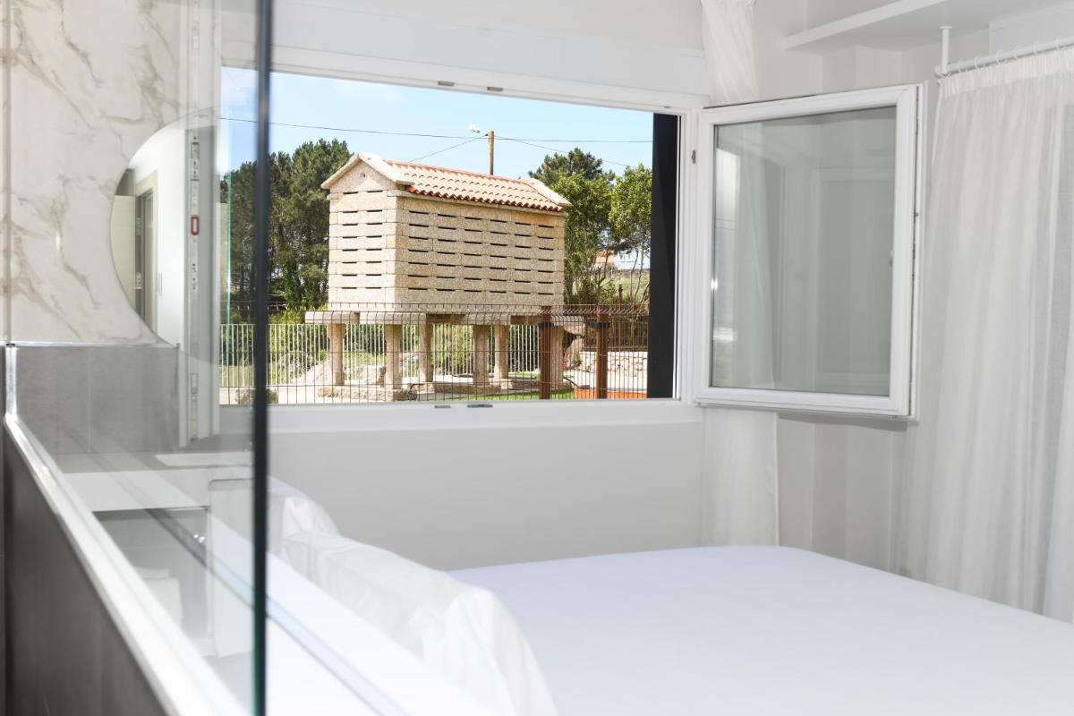 Cama o camas de una habitación en Hotel Spa Meiga do Mar