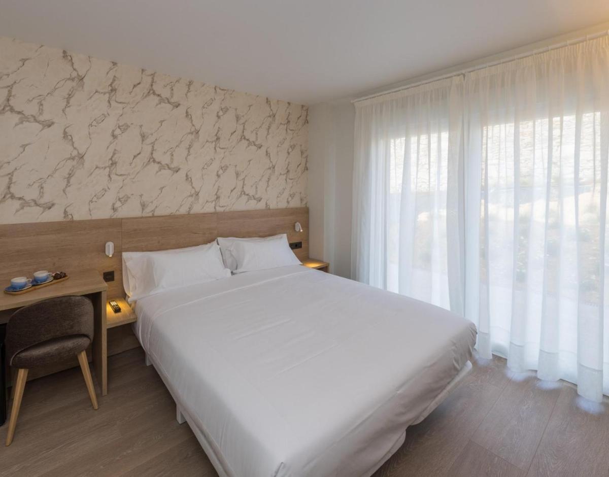 Cama o camas de una habitación en Hotel Spa Meiga do Mar