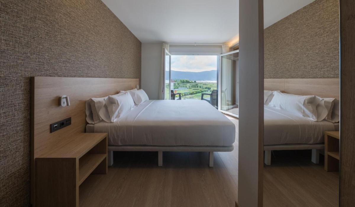 Cama o camas de una habitación en Hotel Spa Meiga do Mar