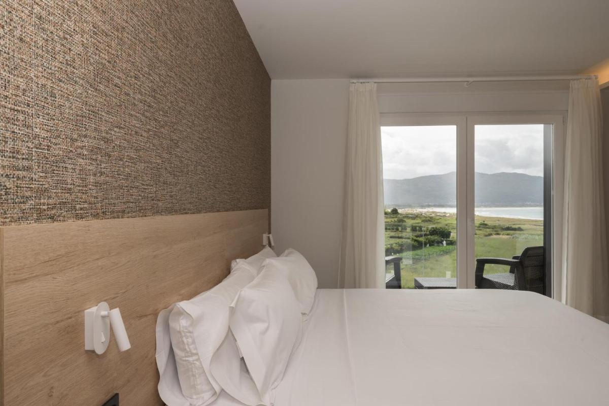 Cama o camas de una habitación en Hotel Spa Meiga do Mar