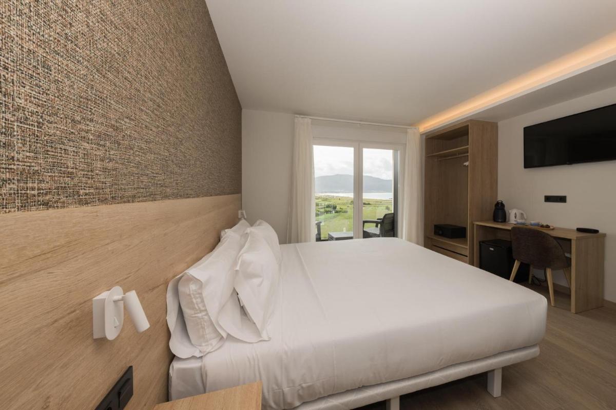 Cama o camas de una habitación en Hotel Spa Meiga do Mar