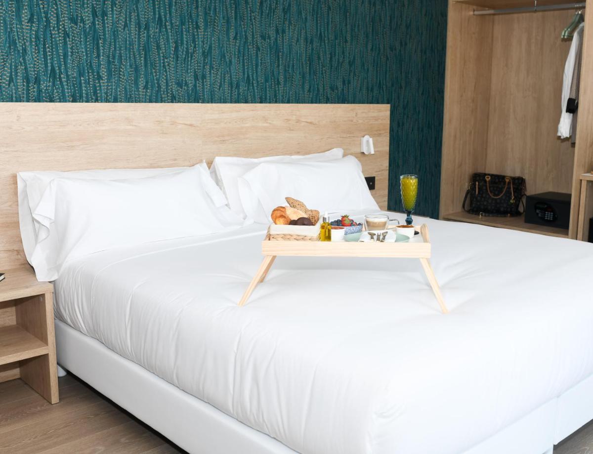 Cama o camas de una habitación en Hotel Spa Meiga do Mar