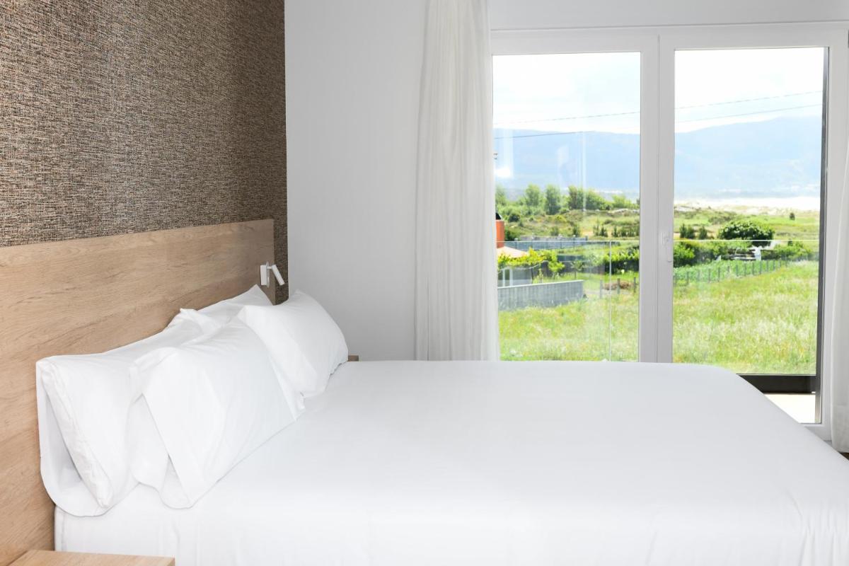 Cama o camas de una habitación en Hotel Spa Meiga do Mar