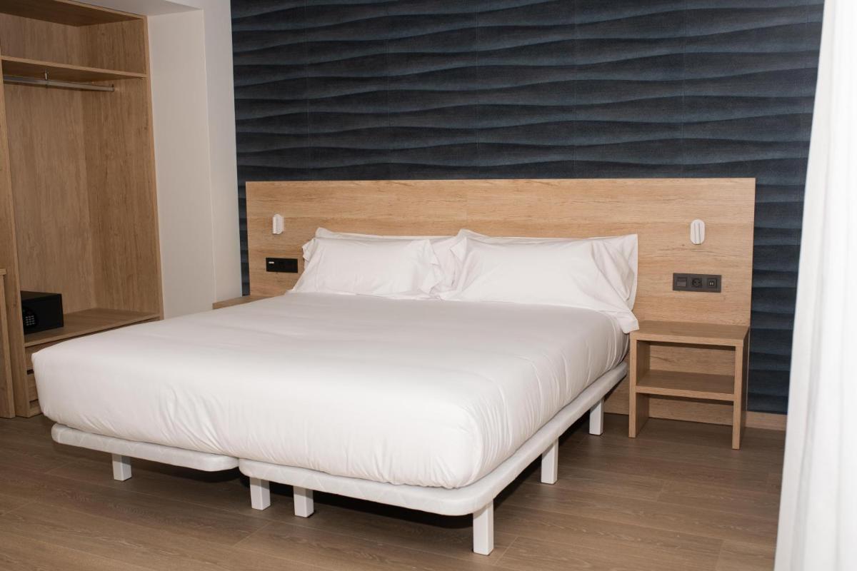 Cama o camas de una habitación en Hotel Spa Meiga do Mar