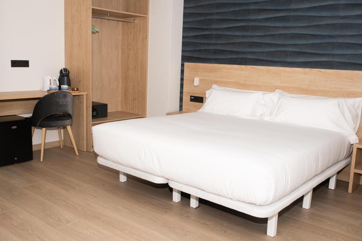 Cama o camas de una habitación en Hotel Spa Meiga do Mar