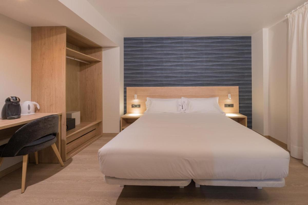 Cama o camas de una habitación en Hotel Spa Meiga do Mar