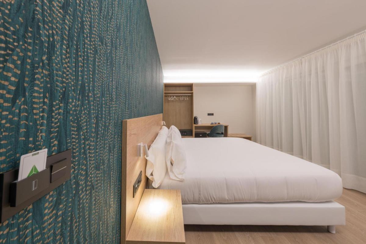 Cama o camas de una habitación en Hotel Spa Meiga do Mar