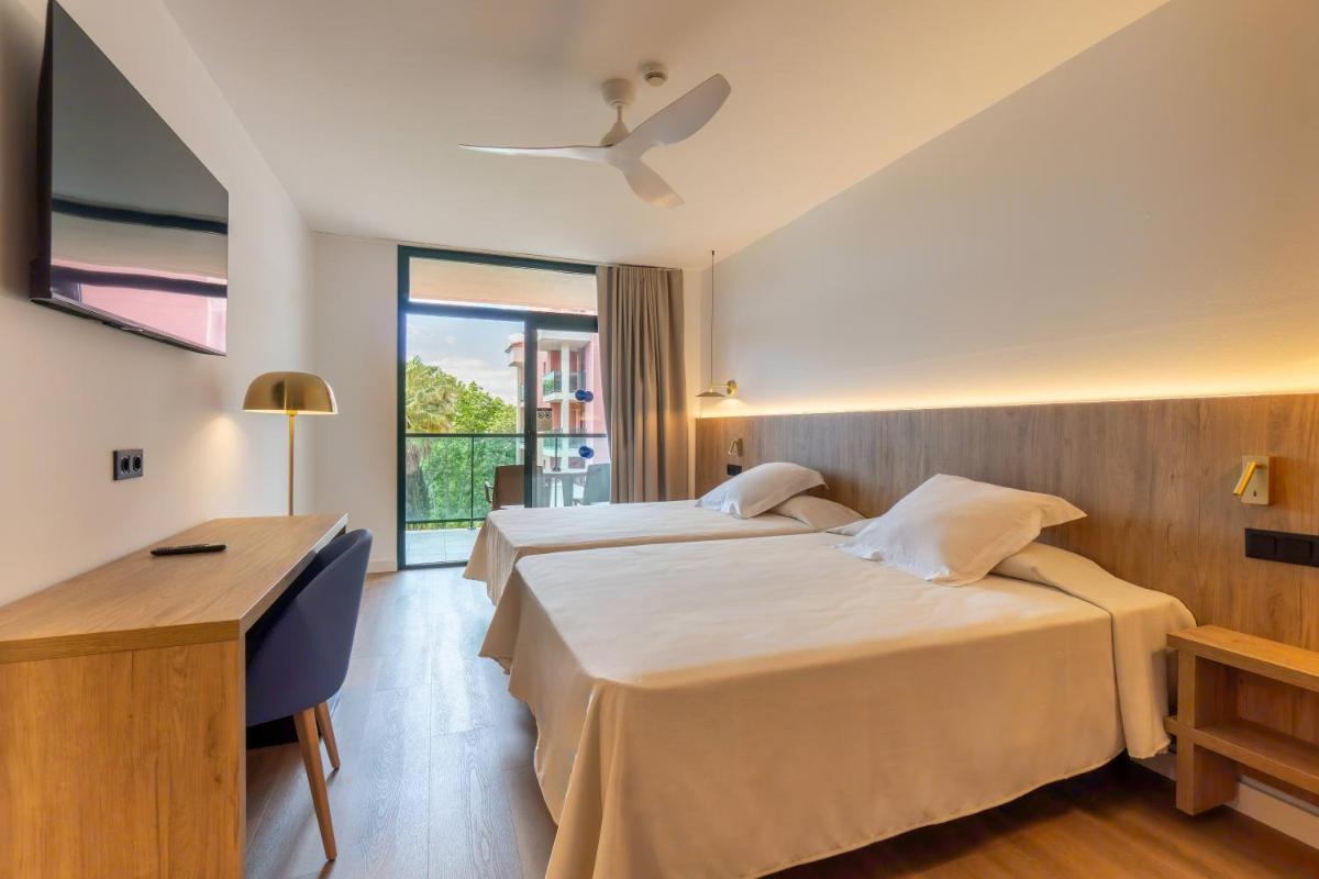 Cama o camas de una habitación en Ohtels Vil·la Romana