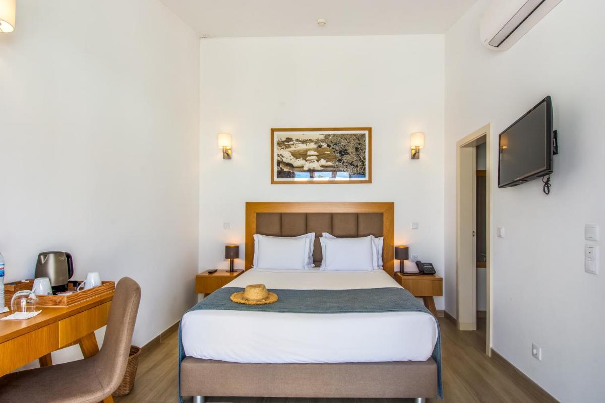Uma cama ou camas num quarto em Hotel Rural Brícia Du Mar