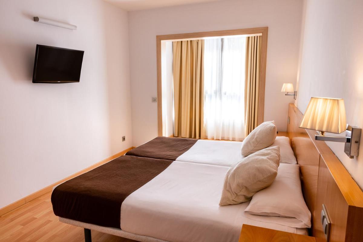 Cama o camas de una habitación en Paradise Park Fun Lifestyle Hotel