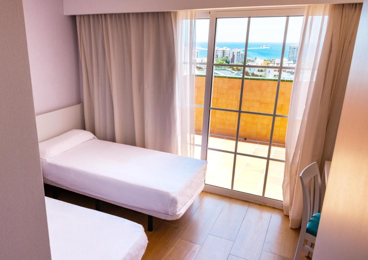 Cama o camas de una habitación en Paradise Park Fun Lifestyle Hotel