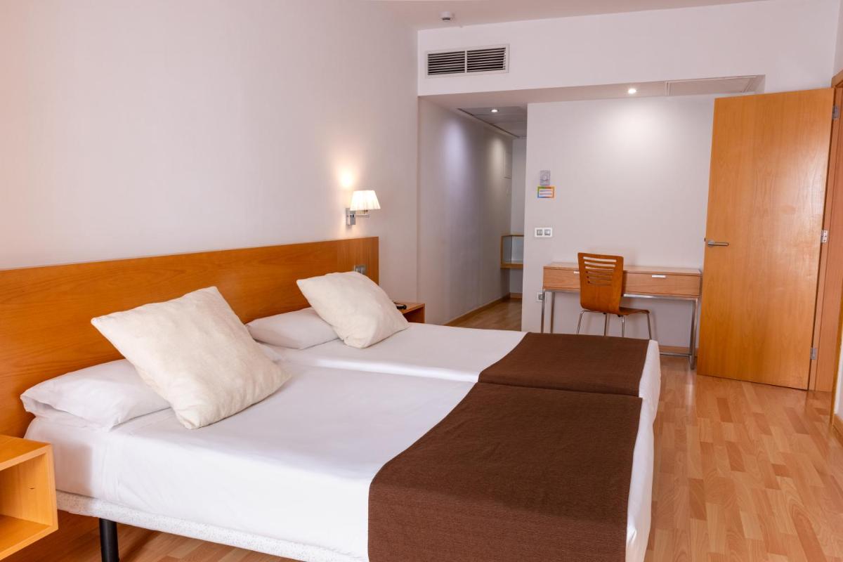 Cama o camas de una habitación en Paradise Park Fun Lifestyle Hotel