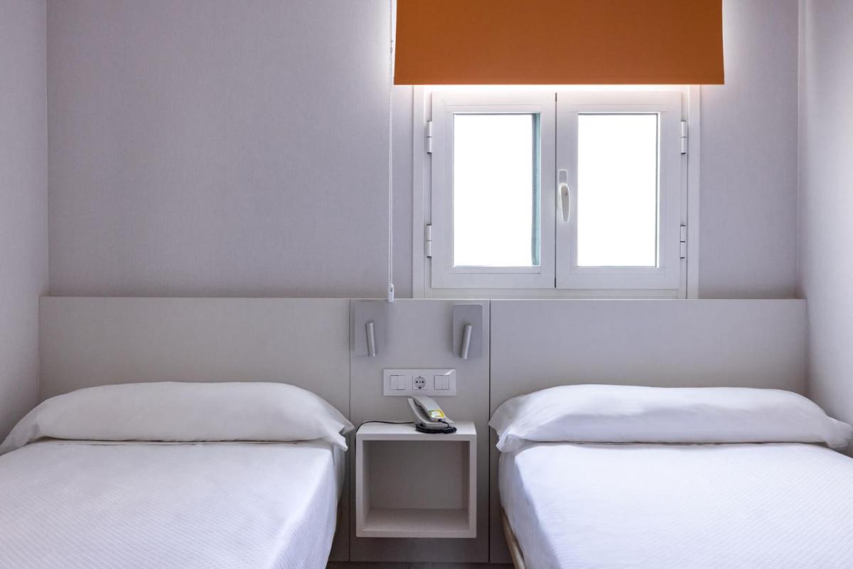 Cama o camas de una habitación en Paradise Park Fun Lifestyle Hotel