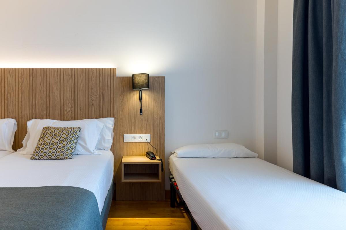 Cama o camas de una habitación en Hotel Silken Villa de Laguardia